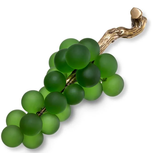 Green grape cluster brooch with gold stem on a white background